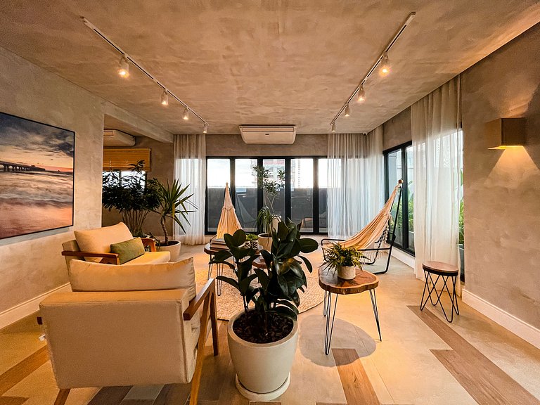 Features a balcony and a rooftop with a pool