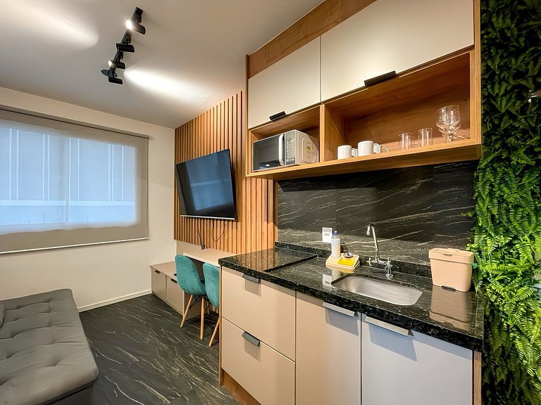 Features a balcony and a rooftop with a pool