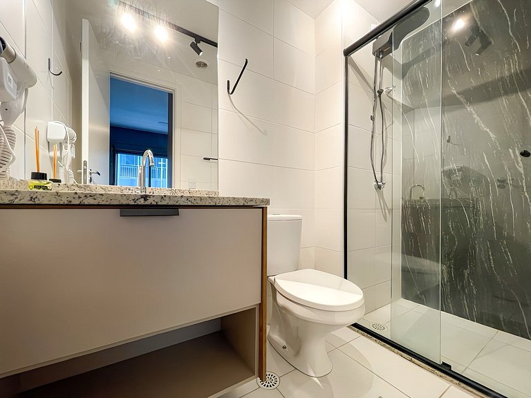 Features a balcony and a rooftop with a pool